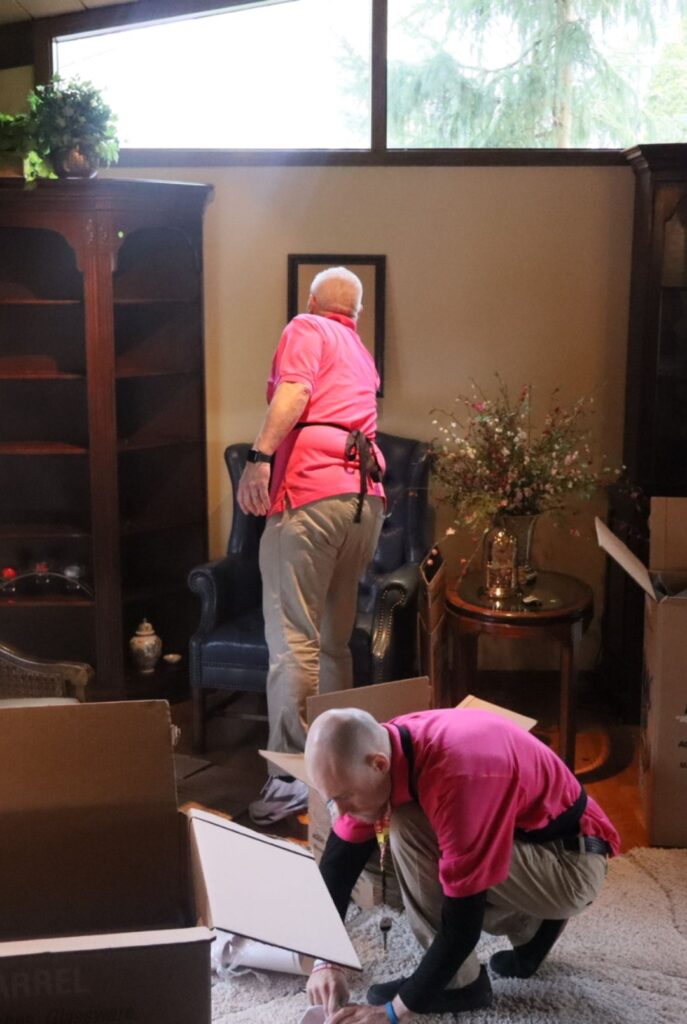 two move managers packing up a clients house