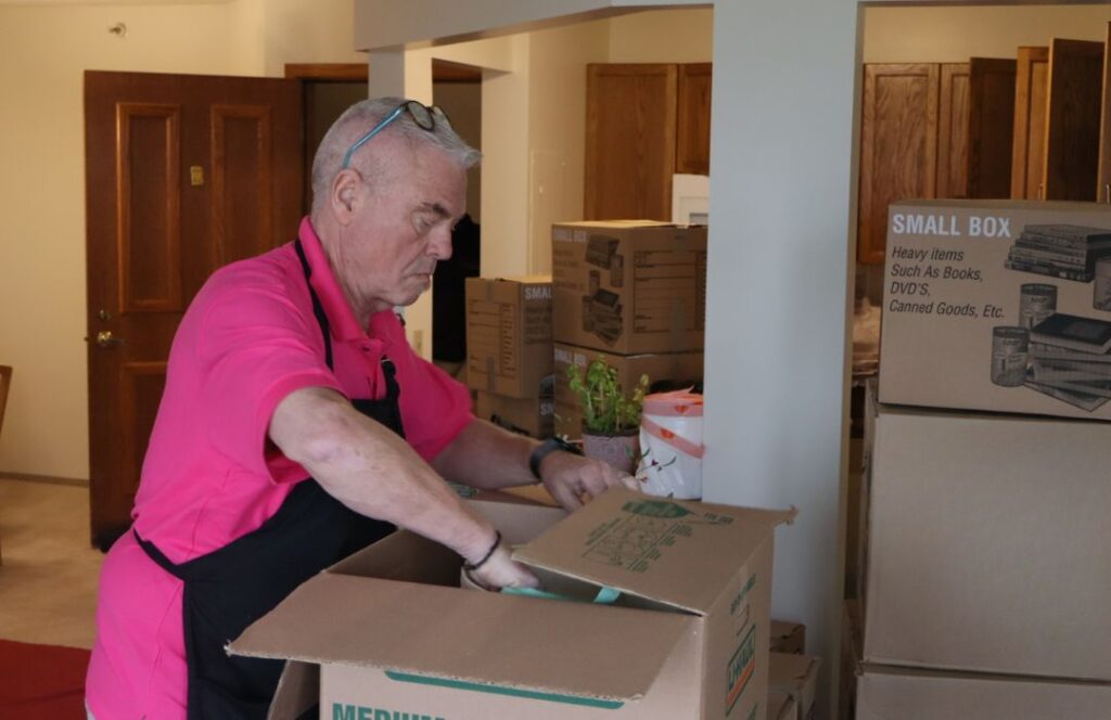 Eddie packing boxes
