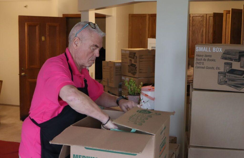 Eddie packing boxes