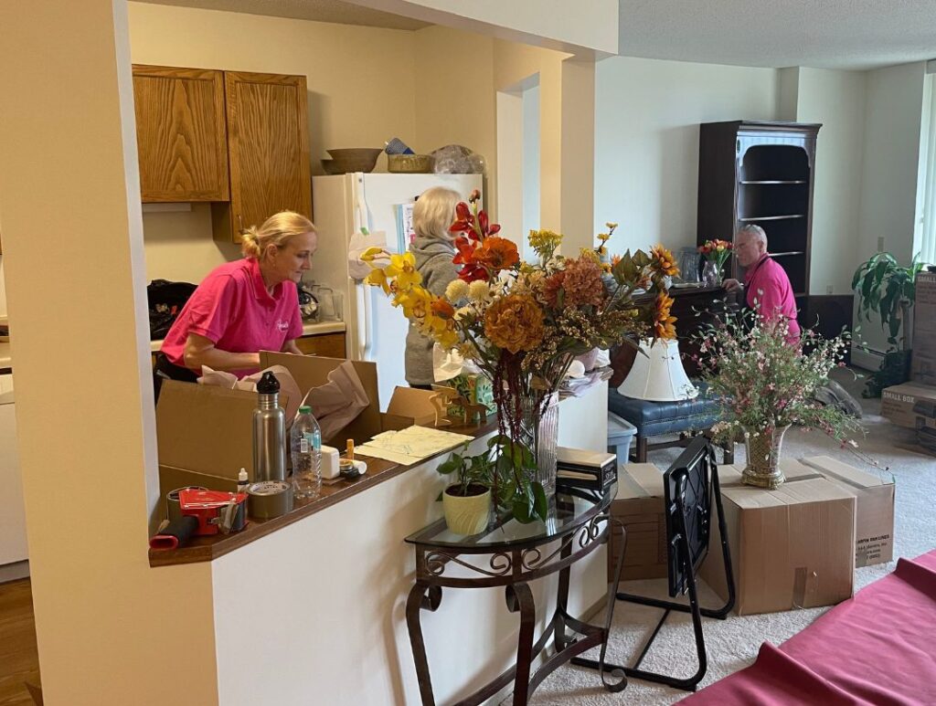 Move managers moving items into a clients new home