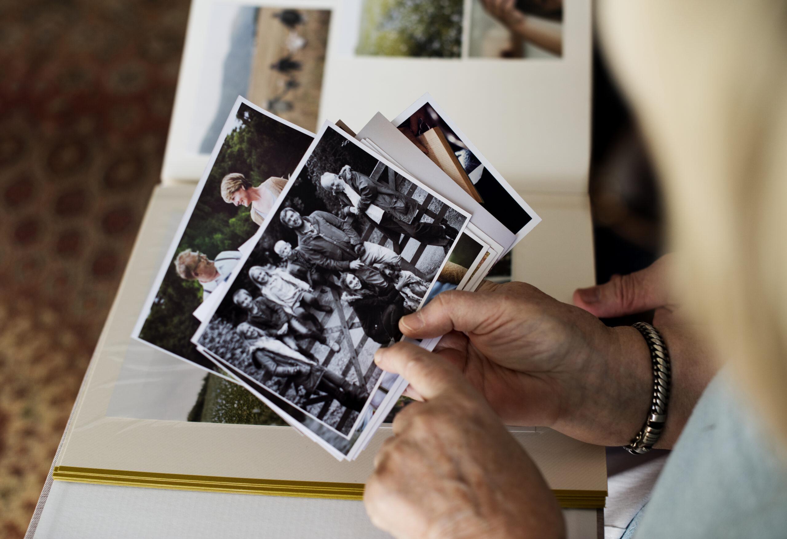 Senior couple looking through a family photo album during a move